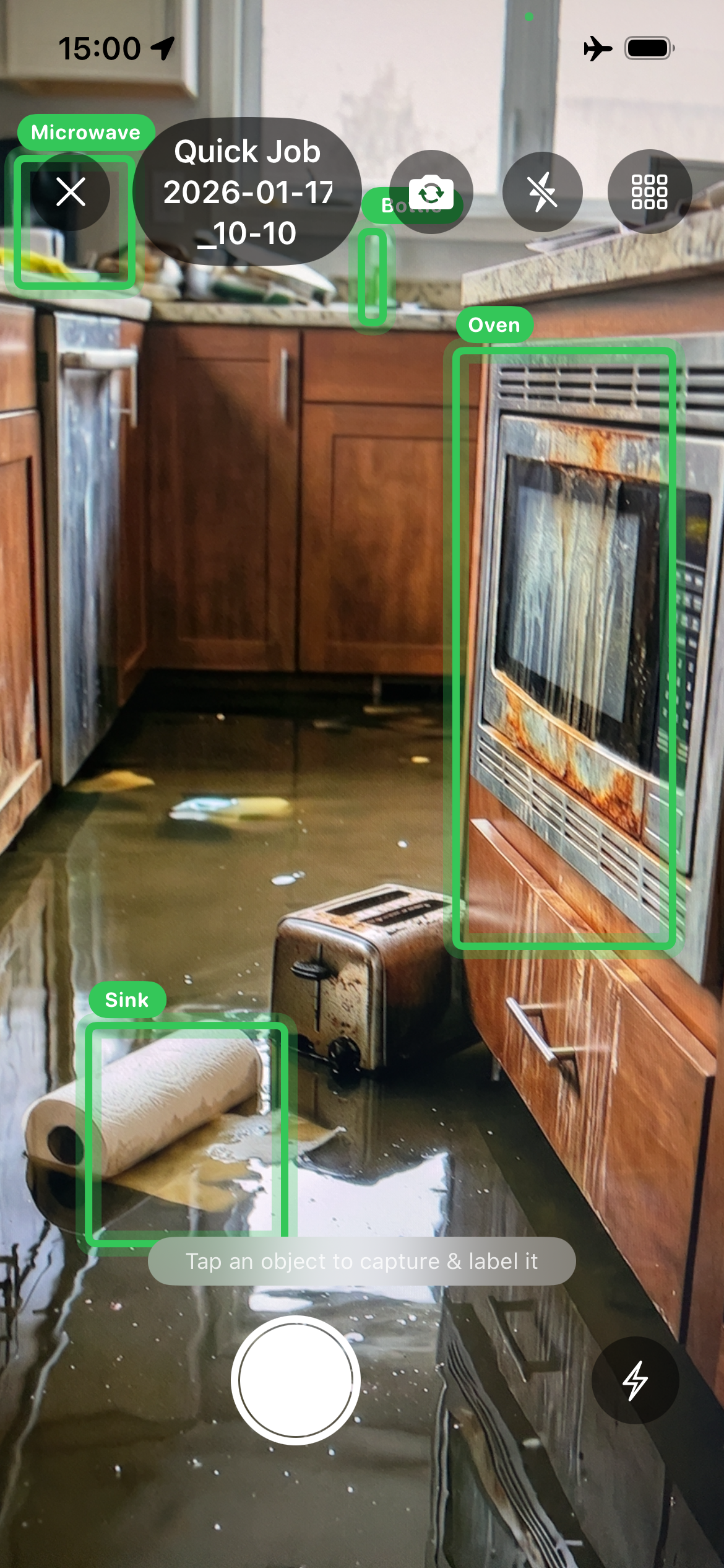 ClaimCam live AI damage detection with bounding boxes on flooded kitchen